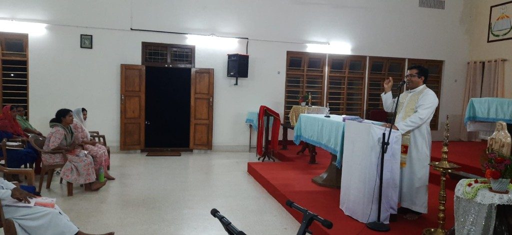 Ayusha Conference 2025 — priest speaking at the lectern