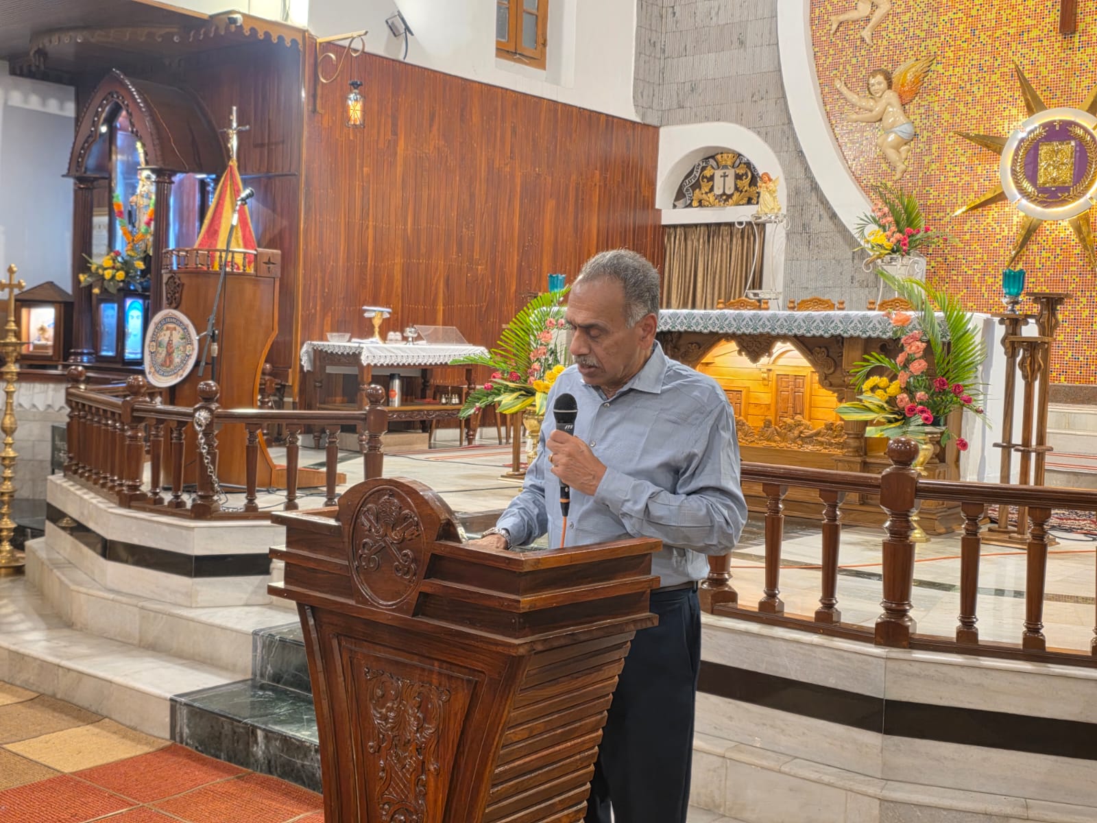 A speaker at the pulpit during the Unbound Freedom in Christ Conference, Mount Carmel Basilica, Munnar, October 2026