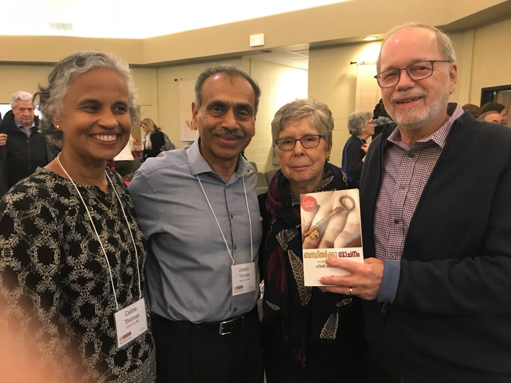 Neal Lozano and Janet Lozano receiving the Malayalam translation for Dr Joseph and Celine